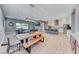 Open concept living space featuring a kitchen, dining, and living room with modern decor at 314 Meadow Brush Pl, Henderson, NV 89011