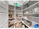 Walk-in pantry with built-in shelving, offering ample storage space for kitchen essentials at 314 Meadow Brush Pl, Henderson, NV 89011