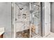 Walk-in shower features decorative tile, dual shower heads, and a built-in niche at 314 Meadow Brush Pl, Henderson, NV 89011