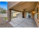 Inviting covered back patio perfect for outdoor living with concrete and an installed ceiling fan at 3189 Sisley Garden Ave, Henderson, NV 89044