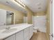 Bathroom featuring a shower-tub combo, and a spacious vanity with a large mirror at 3189 Sisley Garden Ave, Henderson, NV 89044