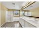 Bathroom with a double sink vanity, soaking tub, and shower at 3189 Sisley Garden Ave, Henderson, NV 89044