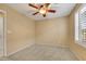 Neutral bedroom featuring carpet, ceiling fan and plantation shutters at 3189 Sisley Garden Ave, Henderson, NV 89044