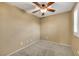 Neutral bedroom featuring carpet, ceiling fan and plantation shutters at 3189 Sisley Garden Ave, Henderson, NV 89044