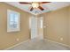 Empty bedroom featuring a ceiling fan, neutral carpet and plantation shutters at 3189 Sisley Garden Ave, Henderson, NV 89044