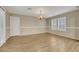 Well-lit dining room with plantation shutters and stylish chandelier, perfect for gatherings and everyday living at 3189 Sisley Garden Ave, Henderson, NV 89044