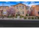 Charming two-story home with a well-manicured lawn and beautiful flowering trees at 3189 Sisley Garden Ave, Henderson, NV 89044
