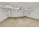 Spacious two car garage with coated floor and overhead storage racks at 3189 Sisley Garden Ave, Henderson, NV 89044
