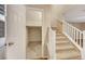 Hallway with stairs to an upper level and a storage area at 3189 Sisley Garden Ave, Henderson, NV 89044