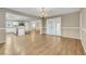 Bright and airy living space connects the kitchen, dining, and stairway, creating an inviting atmosphere for modern living at 3189 Sisley Garden Ave, Henderson, NV 89044