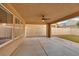 Covered patio area with a ceiling fan and view of the backyard at 3189 Sisley Garden Ave, Henderson, NV 89044