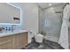 Sleek bathroom with modern fixtures, a glass enclosed shower, and lighted mirror at 3266 S Spring Mountain Blvd, Pahrump, NV 89048