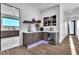 Elegant coffee bar with custom cabinets and a mini fridge at 3266 S Spring Mountain Blvd, Pahrump, NV 89048
