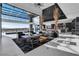 Expansive living area with retractable glass walls showcasing seamless indoor-outdoor living at 3266 S Spring Mountain Blvd, Pahrump, NV 89048