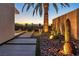 Desert landscaping with cacti and uplighting next to a walkway at 3266 S Spring Mountain Blvd, Pahrump, NV 89048