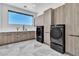 Well-equipped laundry room with ample counter space and modern appliances at 3266 S Spring Mountain Blvd, Pahrump, NV 89048