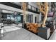 Modern living area with a glass-enclosed wine cellar and stylish decor at 3266 S Spring Mountain Blvd, Pahrump, NV 89048