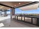 Outdoor kitchen with stainless steel appliances and panoramic views at 3266 S Spring Mountain Blvd, Pahrump, NV 89048