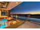 Backyard pool with a waterfall feature, mountain views and outdoor fire pits at 3266 S Spring Mountain Blvd, Pahrump, NV 89048