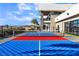 Outdoor sport court featuring a pickleball net with a modern home in the background at 3266 S Spring Mountain Blvd, Pahrump, NV 89048