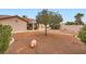Spacious backyard featuring desert landscaping with a covered patio that offers an outdoor living space at 3831 Flickering Star Dr, Las Vegas, NV 89103