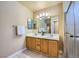 Bathroom features a double sink vanity, and a glass enclosed shower for a luxurious feel at 3831 Flickering Star Dr, Las Vegas, NV 89103