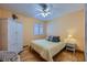 This charming bedroom features a cozy bed, a wicker chair, and a cute bedside table at 3831 Flickering Star Dr, Las Vegas, NV 89103