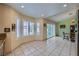 Bright kitchen with an eat-in area, tile floors, and plantation shutters at 3831 Flickering Star Dr, Las Vegas, NV 89103