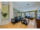Comfortable living room featuring hardwood floors, vaulted ceilings, and stylish furniture at 3831 Flickering Star Dr, Las Vegas, NV 89103