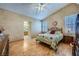 Cozy main bedroom with a decorative ceiling fan, shutters, and ensuite bathroom access at 3831 Flickering Star Dr, Las Vegas, NV 89103