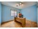 Bright office space features a desk by the window and wood floors at 3831 Flickering Star Dr, Las Vegas, NV 89103