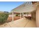 Enjoy the outdoors on this spacious covered patio overlooking the landscaped backyard at 3831 Flickering Star Dr, Las Vegas, NV 89103