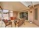 Relax on this covered patio with comfortable seating, perfect for outdoor entertaining at 3831 Flickering Star Dr, Las Vegas, NV 89103