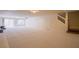 Large basement features carpeting, recessed lighting, and access to the upper levels via stairs at 4372 Melrose Abbey Pl, Las Vegas, NV 89141