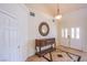 Welcoming foyer with decorative mirror, console table, and patterned tile flooring at 4372 Melrose Abbey Pl, Las Vegas, NV 89141