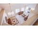 Second story view of foyer with tile floors, fireplace, high ceilings and ornate front doors at 4372 Melrose Abbey Pl, Las Vegas, NV 89141