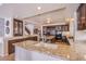 Well-appointed kitchen with granite countertops, custom cabinets, and stainless steel appliances at 4372 Melrose Abbey Pl, Las Vegas, NV 89141