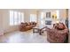 Elegant living room with large windows, fireplace, and stylish furnishings at 4372 Melrose Abbey Pl, Las Vegas, NV 89141