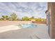 Backyard showcasing a swimming pool, hot tub, and a concrete patio ideal for outdoor gatherings at 4372 Melrose Abbey Pl, Las Vegas, NV 89141
