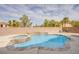 Inviting backyard pool and spa are surrounded by lush landscaping and a privacy fence at 4372 Melrose Abbey Pl, Las Vegas, NV 89141
