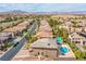 Back of a home in a residential area, showing a pool, spa, and a patio at 4372 Melrose Abbey Pl, Las Vegas, NV 89141