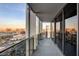 Balcony showcasing the city skyline through frameless glass railings and sliding doors at 4381 W Flamingo Rd # 3002, Las Vegas, NV 89103