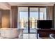 Bathroom view with a stand-alone tub next to a glass door to a balcony with a great view at 4381 W Flamingo Rd # 3002, Las Vegas, NV 89103