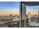 Scenic city view from a balcony, showcasing the vibrant city skyline at sunset at 4381 W Flamingo Rd # 3002, Las Vegas, NV 89103