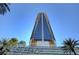 Exterior shot of luxury high-rise features modern architecture and vibrant signage at 4381 W Flamingo Rd # 3002, Las Vegas, NV 89103