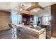 Contemporary kitchen features stainless steel counters and island with views of the city at 4381 W Flamingo Rd # 3002, Las Vegas, NV 89103