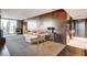 Modern living room boasts wood accent wall, sleek furniture, and city views through large windows at 4381 W Flamingo Rd # 3002, Las Vegas, NV 89103