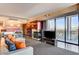 Open living area with a modern kitchen, fireplace, comfortable seating, and city views at 4381 W Flamingo Rd # 3002, Las Vegas, NV 89103