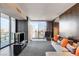 Contemporary living room with a large screen TV, comfortable seating, and cityscape views at 4381 W Flamingo Rd # 3002, Las Vegas, NV 89103