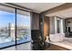 Relaxing main bedroom with soaking tub by large windows overlooking the Las Vegas cityscape at 4381 W Flamingo Rd # 3002, Las Vegas, NV 89103